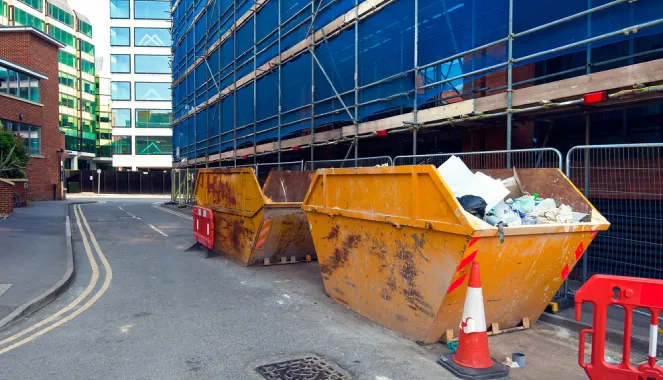 two skips on a building site