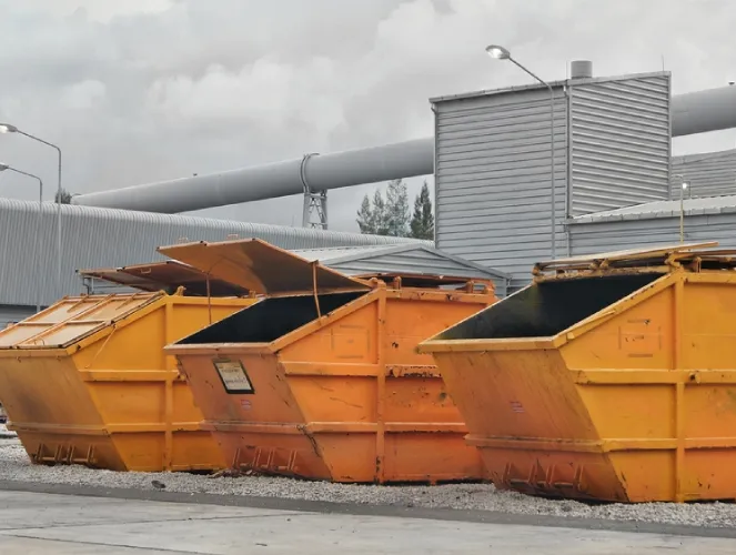 three yellow skips